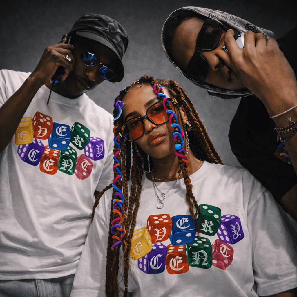 Three people wearing Every Cent World dice tees